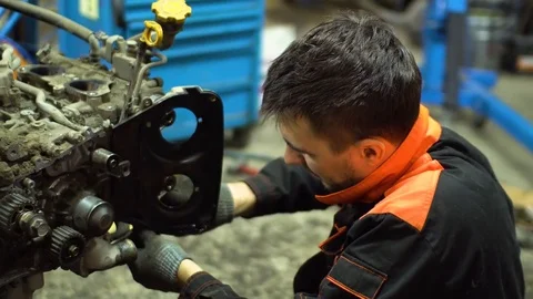 Professional car mechanic fix engine Stock Footage 73284931