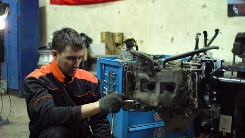 Professional car mechanic fix engine Stock Footage 73285151