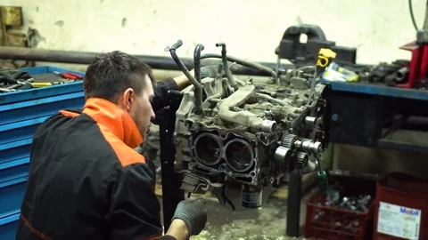 Professional car mechanic fix engine Stock Footage 73285588