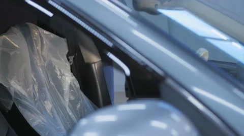 Professional car mechanic working in modern auto repair service and checking Stock Footage