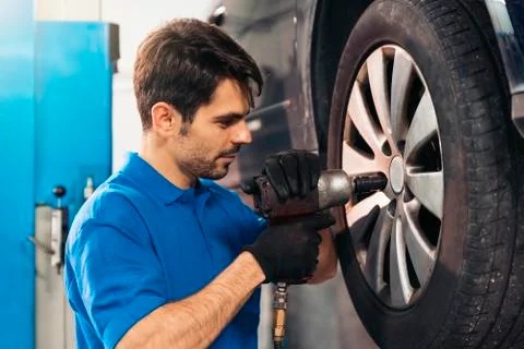 Professional Car Mechanic working. Stock Photos