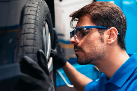 Professional Car Mechanic working. Stock Photos