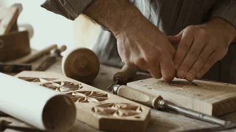 Professional carpenter carving wood with a chisel Stock Footage 90372089