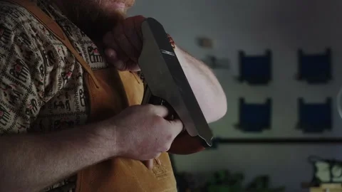 A professional carpenter sets up a tool for the job. 動画素材 156509955