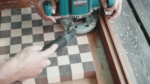 Professional carpenter using grinding machine for carving holes on wooden board Video stock 162993952