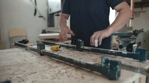 Professional carpenter using industrial ruler for measuring length of steel Stock-Footage 163444716