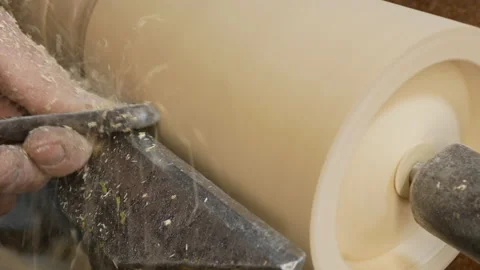 Professional carpenter is using skew chisel for shaping piece of wood Stock Footage 150363707