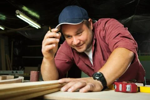Professional carpenter at work. Stock Photos