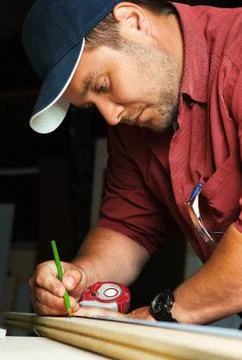 Professional carpenter at work. Stock Photos