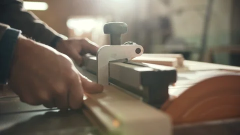 Professional Carpenter working with Saw Machine at the Workshop, handmade and Stock Footage 124705770
