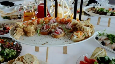 Professional catering setup displaying gourmet appetizers, salmon bruschetta Foto stock