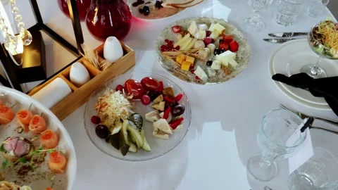 Professional catering team preparing gourmet appetizers, salads, cheese platters Stock Footage 331464162