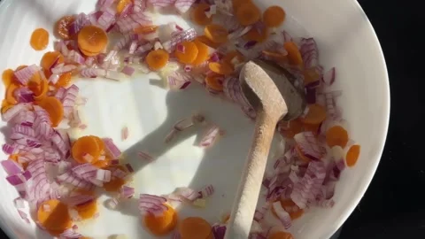 Professional cheef cook frying diced carrot and onion, in a frying pan., slow 库存影片 330106066