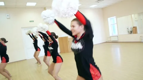 Professional cheerleaders make a dance performance Stock Footage 185436273