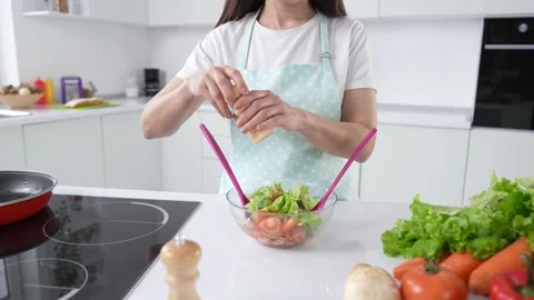 Professional chef adding herbal variety flavors into ready green salad Stock Footage 196796705