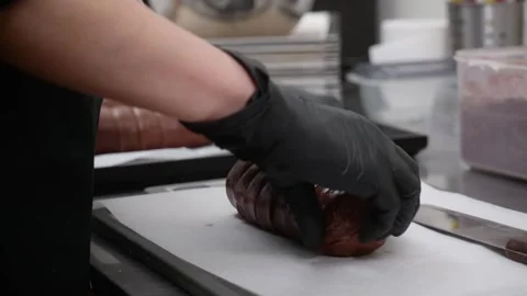 Professional Chef in Black Gloves Placing Sweet Dessert Pastry Roll on Tray in C Stock Footage 337751712