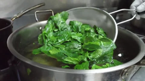 Professional Chef Blanching Fresh Green Basil Leaves in Boiling Water for Authen Stock Footage 337678205