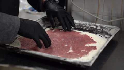 Professional chef breading raw meat with flour for traditional Wiener schnitzel Stock Footage 337899911
