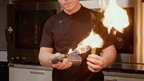 Professional Chef Burning Fresh Thyme with Gas Blowtorch Stock Footage 339451766