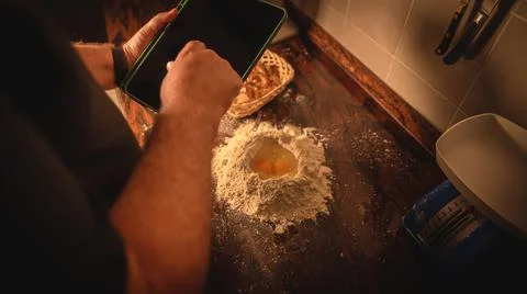 Professional chef checking the ingredients and using his hands for grounding a d 스톡 사진