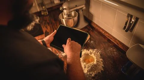 Professional chef checking the ingredients and using his hands for grounding a d 写真素材