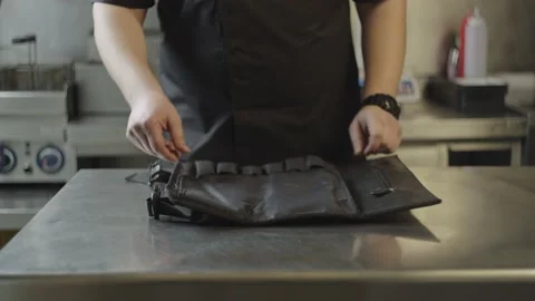 A professional chef chooses a knife from his set. Stock Footage 232958079