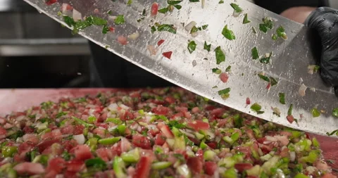 Professional chef chopping vegetables tomato bell pepper onion parsley Stock Footage 295954822