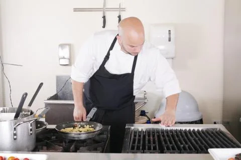 Professional chef cleaning the kitchen Stock Photos