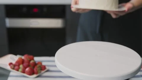 Professional chef is cooking cake. Close up of beautiful white cake with Stock Footage 132460016