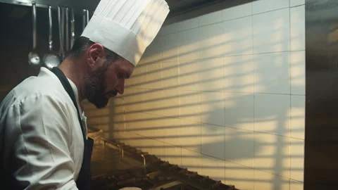 Professional Chef cooking with light from the window Stock Footage 269961306