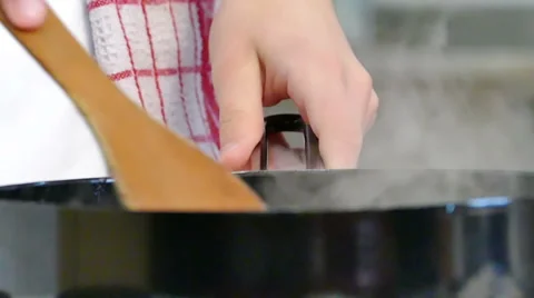 Professional Chef Cooks Fish in a Pan in Slow Motion Video stock 60611876