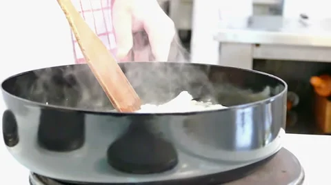 Professional Chef Cooks Fish in a Pan in Slow Motion Stock Footage 60611877