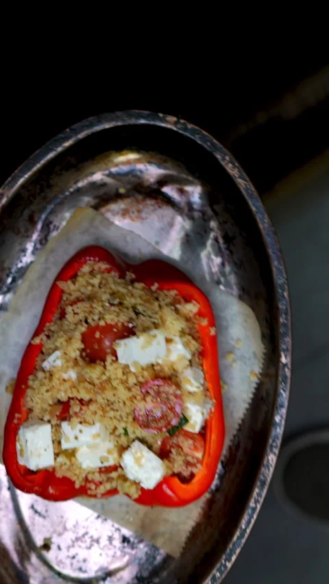Professional chef creating stuffed red bell pepper, filling with couscous Stock-Footage 309167307