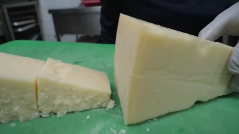 Professional Chef Cutting Aged Parmesan Cheese for Italian Pizza Preparation - C Stock Footage 337678397