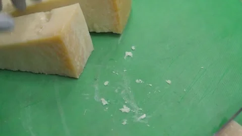 Professional Chef Cutting Authentic Italian Hard Cheese for Pizza Preparation Stock Footage 337678188