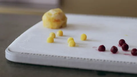 Professional chef cutting beets and putting them onto a cutting board in interio Stock Footage 199457582