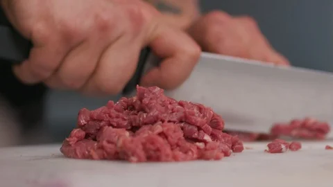 Professional chef cutting fresh meat raw lunch condiment preparation beef board Stock Footage 103289258