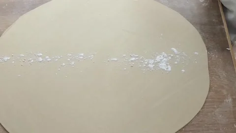 Professional Chef Dusting Large Round Flatbread Dough with Flour Stock Footage 333522885