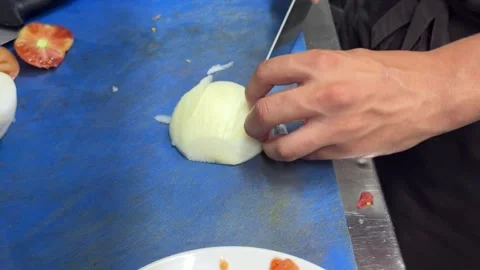 Professional chef finely dicing a white onion Video stock 344100088