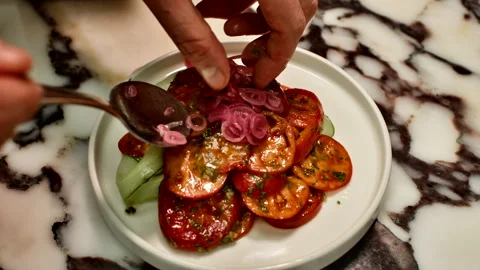 Professional Chef Garnish Tomato and Cucumber Salad with Pickled Onions Stock Footage 328705086