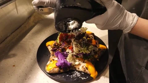 Professional Chef Grating Fresh Cheese over Gourmet Star-Shaped Italian Pizza wi Video stock 337678988