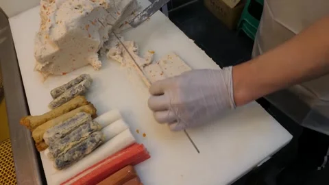 Professional Chef Hands Making Traditional Korean Fish Cake Eomuk with Vegetable Stock Footage 337373245