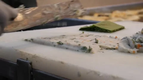 Professional Chef Hands Making Traditional Korean Fish Cake (Eomuk) with Vegetab Stock Footage 337374902