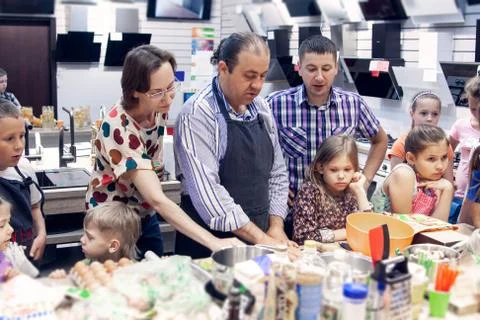 A professional chef holds a master class for children Stock Photos