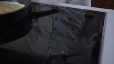 Professional Chef in the Kitchen of Restaurant prepares Pancakes. Slow motion 스톡 동영상 143416010