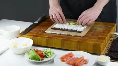 Professional chef making sushi at restaurant. Stock Footage 149525474