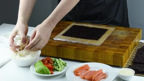 Professional chef making sushi at restaurant. Video stock 149525476