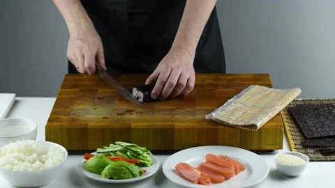 Professional chef making sushi at restaurant. Stock Footage 149525486