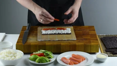 Professional chef making sushi at restaurant. Stock Footage 149525510