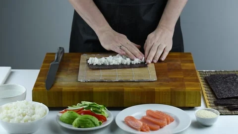 Professional chef making sushi at restaurant. Stock Footage 149525517